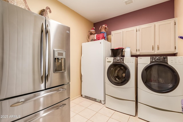 washroom with light tile patterned floors and independent washer and dryer