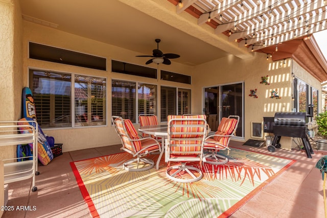 view of patio featuring grilling area, ceiling fan, and a pergola