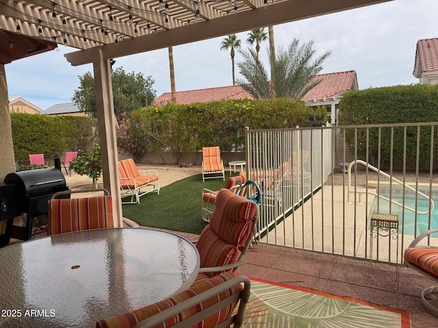 view of patio featuring area for grilling and a pergola