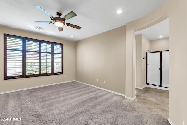 carpeted spare room with a ceiling fan, recessed lighting, visible vents, and baseboards