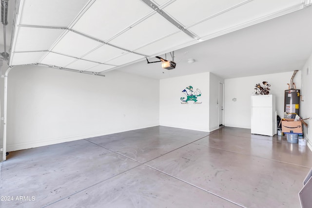 garage featuring a garage door opener, freestanding refrigerator, gas water heater, and baseboards