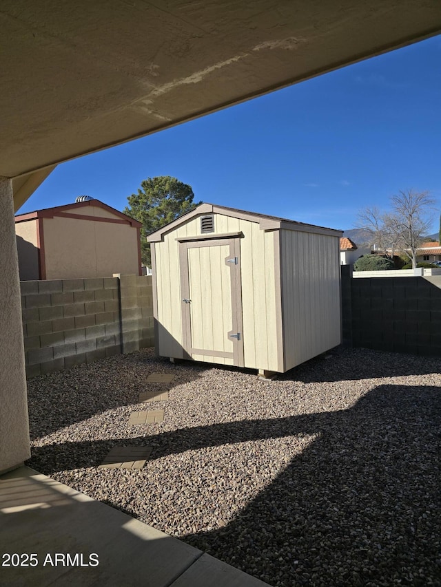 view of shed featuring a fenced backyard