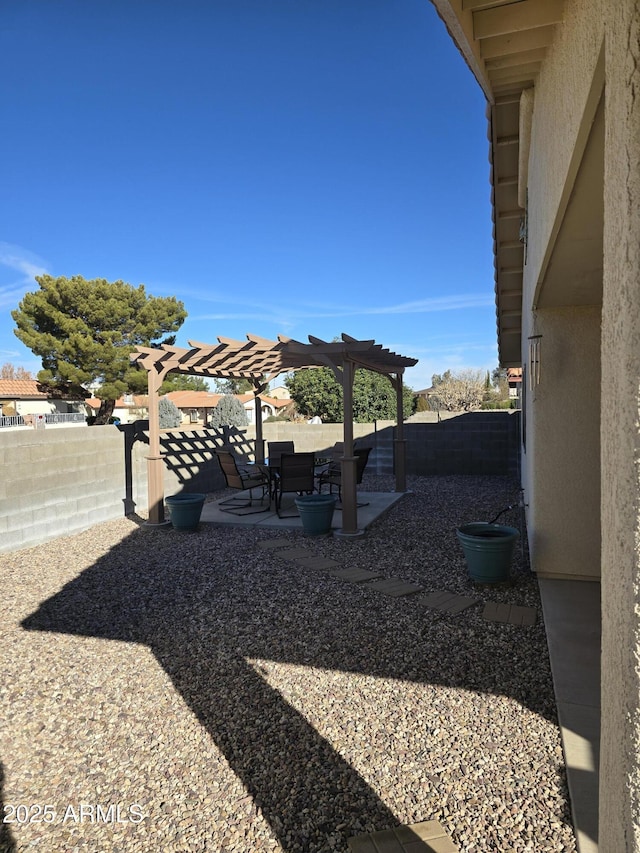 view of yard featuring a fenced backyard, a pergola, and a patio