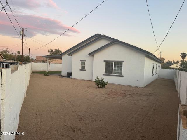 view of property exterior at dusk