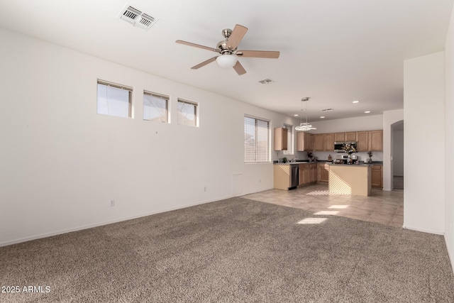 unfurnished living room with light colored carpet and ceiling fan