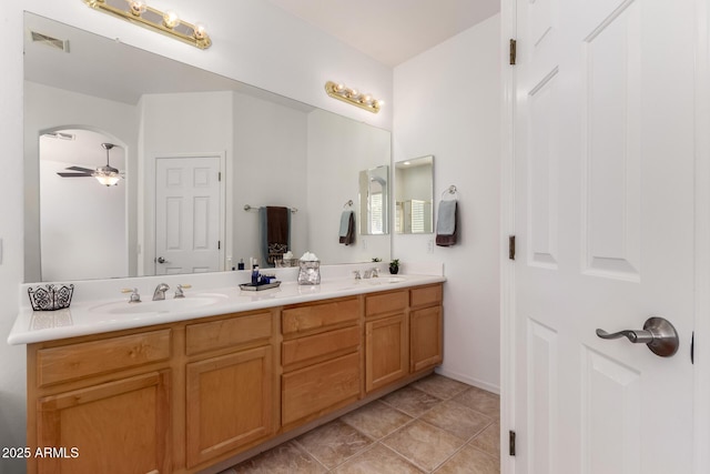 bathroom featuring vanity, tile patterned flooring, and ceiling fan