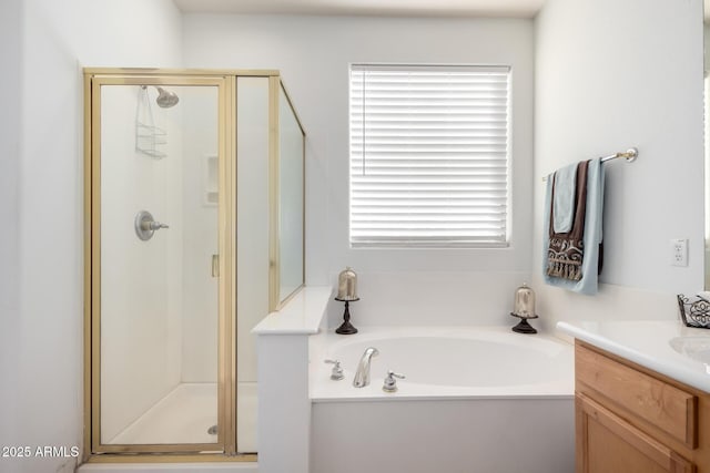 bathroom featuring vanity and separate shower and tub