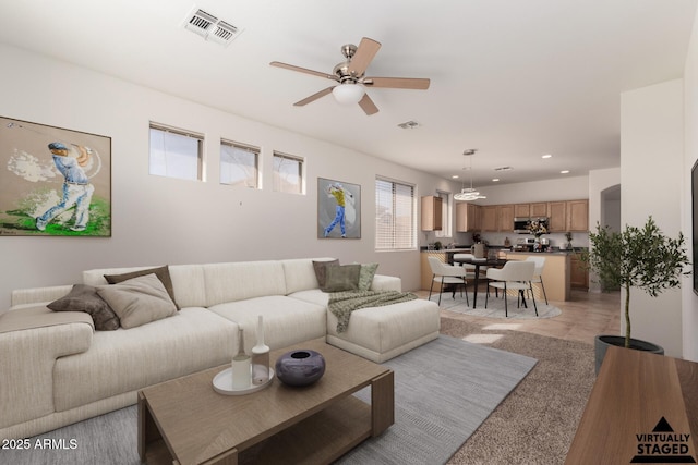 living room with ceiling fan