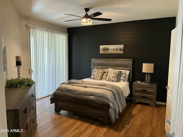 14250 W Wigwam Blvd Unit 812, Litchfield Park, AZ 85340 - bedroom featuring a ceiling fan and wood finished floors