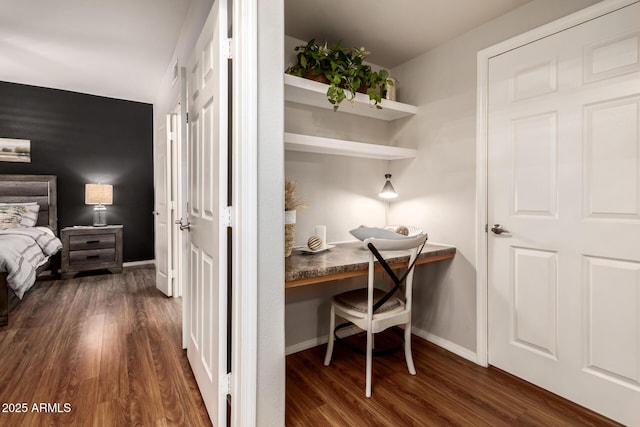 14250 W Wigwam Blvd Unit 812, Litchfield Park, AZ 85340 - bedroom with dark wood-type flooring, built in desk, and baseboards
