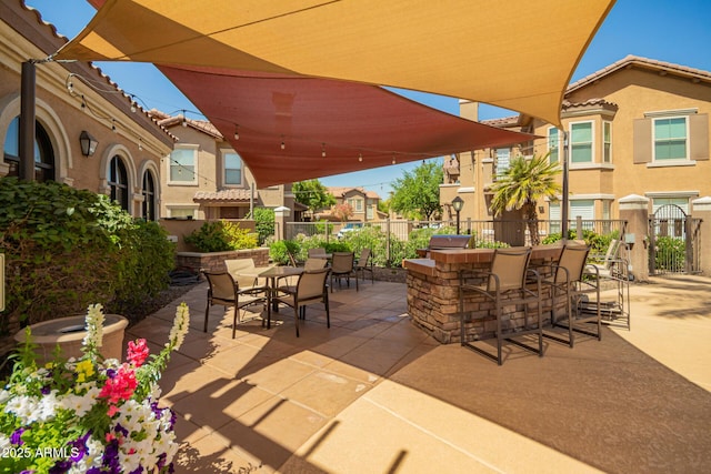 14250 W Wigwam Blvd Unit 812, Litchfield Park, AZ 85340 - view of patio with outdoor dining space and fence