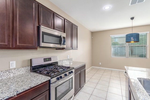 kitchen with visible vents, hanging light fixtures, appliances with stainless steel finishes, dark brown cabinetry, and baseboards