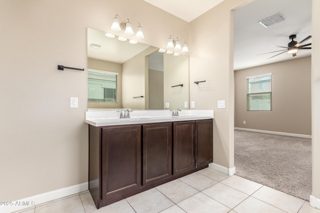 full bath with double vanity, visible vents, ceiling fan, a sink, and tile patterned flooring