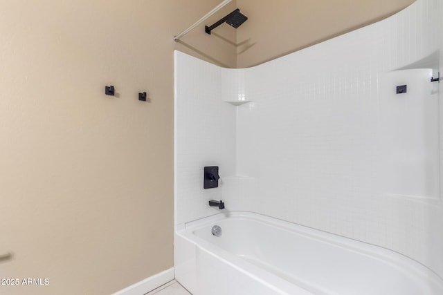 full bath with tile patterned flooring, bathtub / shower combination, and baseboards