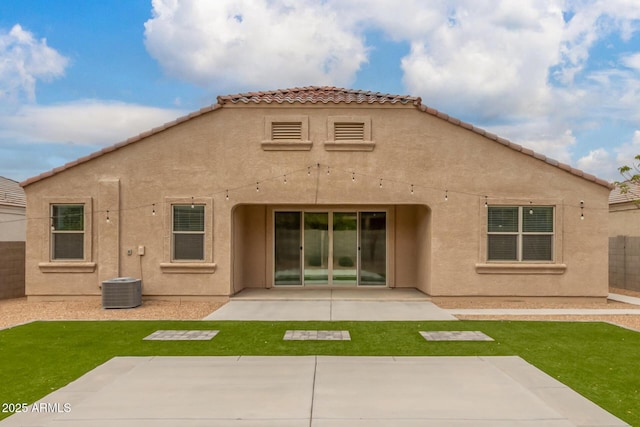 back of property featuring a patio, central AC, a tiled roof, and stucco siding