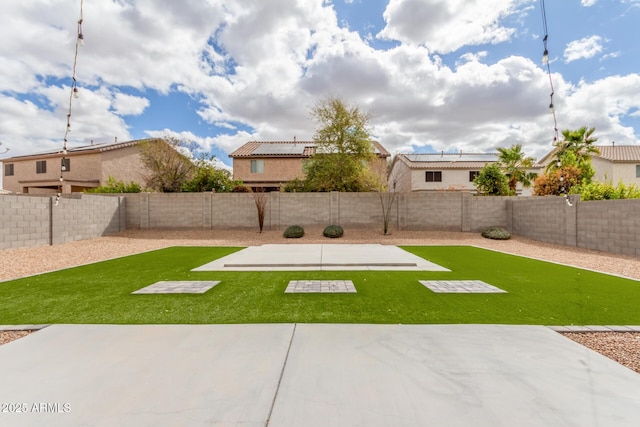 view of yard with a patio area and a fenced backyard