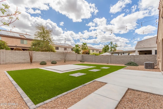 view of yard with central AC, a patio, and a fenced backyard