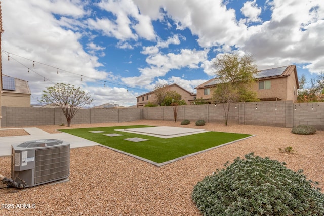 view of yard featuring central AC, a patio, and a fenced backyard