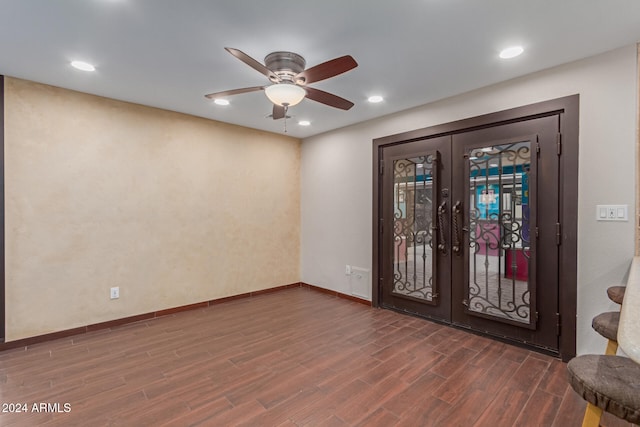 foyer with french doors, dark hardwood / wood-style flooring, and ceiling fan