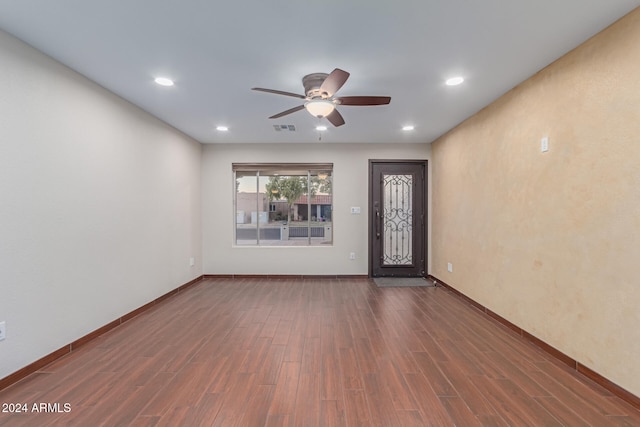 interior space with ceiling fan and dark wood-type flooring