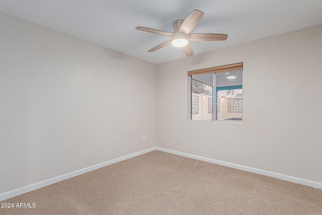 spare room with ceiling fan and carpet floors