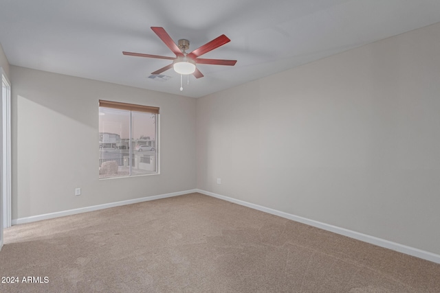 carpeted empty room with ceiling fan