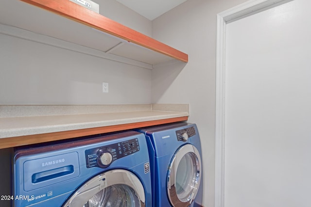 laundry area featuring washing machine and clothes dryer