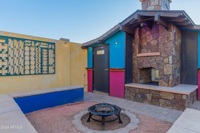 view of patio / terrace featuring an outdoor fire pit