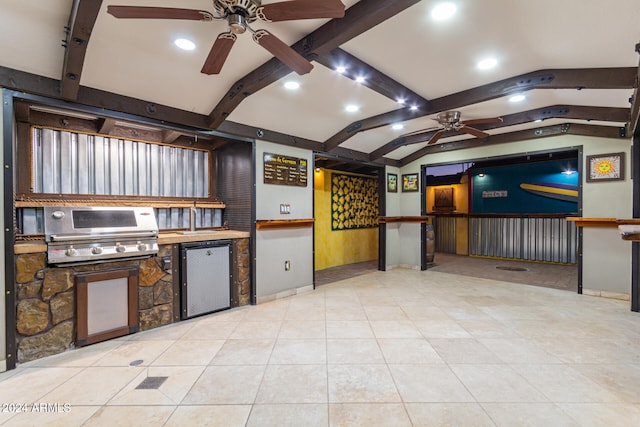 interior space with vaulted ceiling with beams, ceiling fan, light tile patterned flooring, and fridge