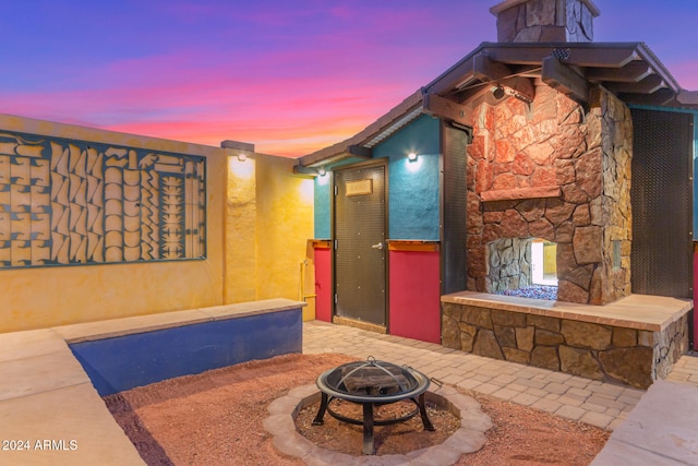 patio terrace at dusk with an outdoor fire pit