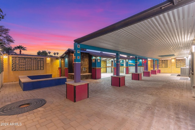 view of patio terrace at dusk