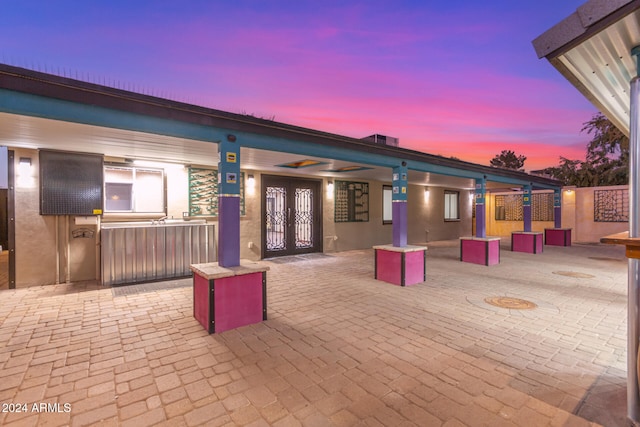 view of patio terrace at dusk