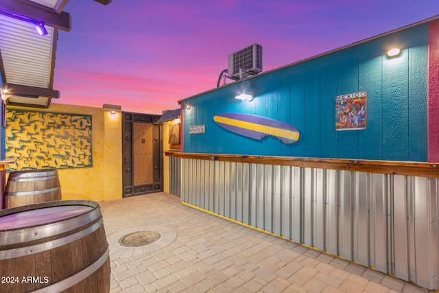 patio terrace at dusk with central AC unit