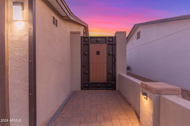 view of exterior entry at dusk