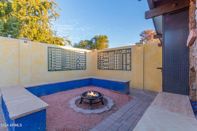 view of patio with a fire pit