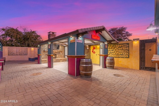 view of patio terrace at dusk