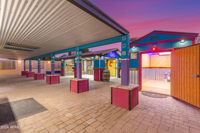 view of patio terrace at dusk