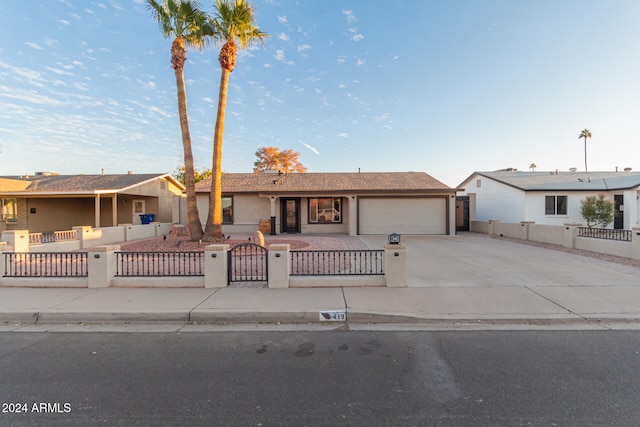 ranch-style house featuring a garage