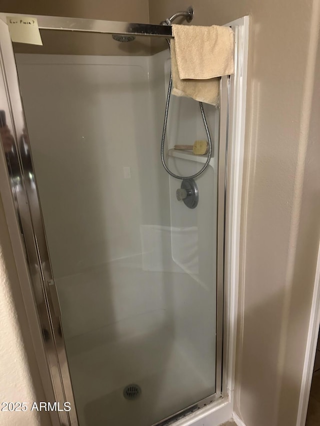 full bath featuring a stall shower