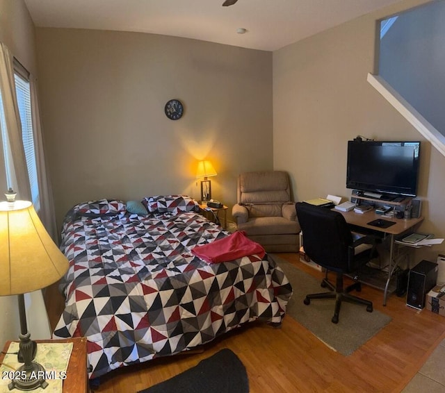 bedroom featuring wood finished floors