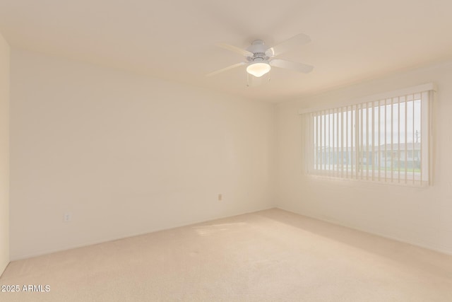 unfurnished room featuring carpet and ceiling fan