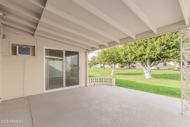 view of patio / terrace featuring an AC wall unit