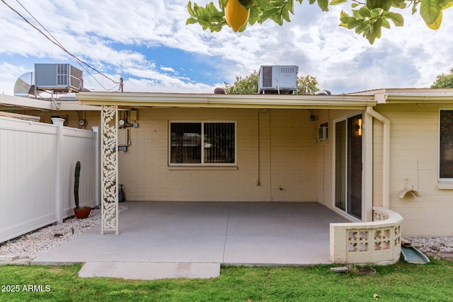 back of property featuring cooling unit and a patio area