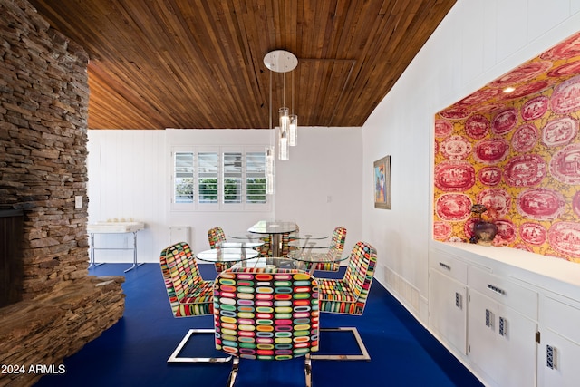 unfurnished dining area with wood ceiling