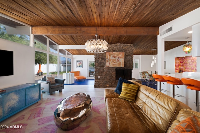 living room featuring a stone fireplace, wood ceiling, lofted ceiling with beams, and an inviting chandelier