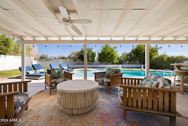 view of patio featuring ceiling fan, a fenced in pool, and an outdoor living space