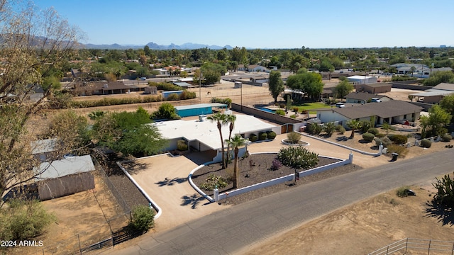 birds eye view of property featuring a mountain view