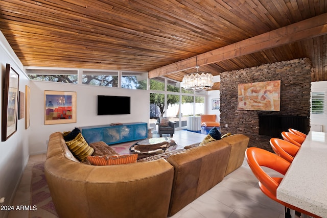 living room with a stone fireplace, tile patterned flooring, wooden ceiling, lofted ceiling with beams, and a chandelier