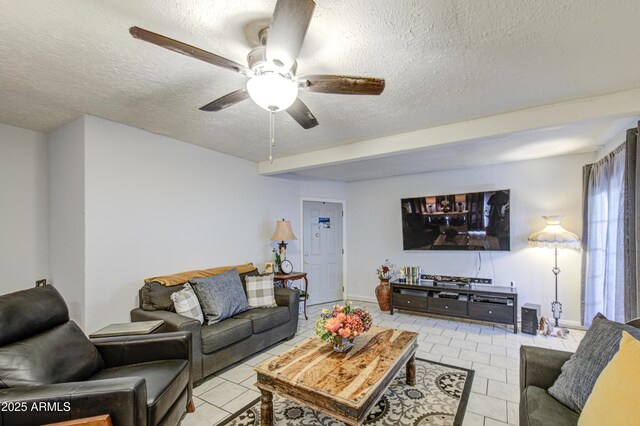 4112 E Maldonado Dr, Phoenix, AZ 85042 - tiled living area with a textured ceiling, baseboards, and ceiling fan
