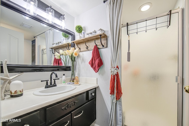 4112 E Maldonado Dr, Phoenix, AZ 85042 - bathroom featuring a shower stall, vanity, and visible vents